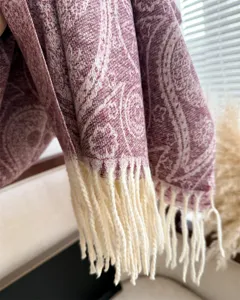 Close-up detail of winter paisley tassel scarf soft warm cozy fashion accessory for daily wear