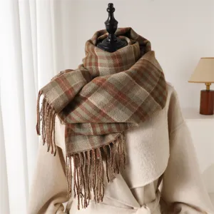 Detailed view of the winter plaid tassel scarf, cozy and stylish cashmere feel fabric.