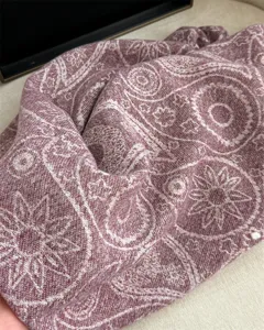 Detailed close-up of the autumn winter paisley pattern cashmere feel shawl scarf.