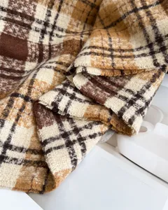 Cozy plaid blanket scarf for autumn and winter, soft faux cashmere tassel wrap accessory.
