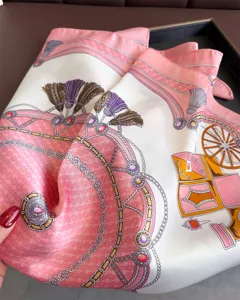 Luxurious French carriage print silk square scarf, elegant pink and gold shawl wrap for women.