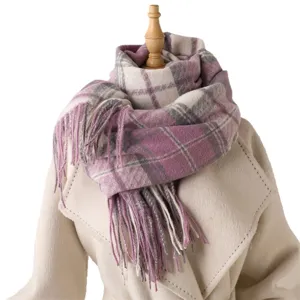 Cozy plaid tassel scarf for autumn and winter, warm and stylish winter accessory.