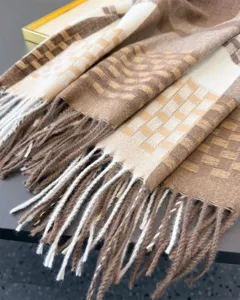 Close-up detail of cozy brown and white plaid tassel scarf, showcasing soft texture and warm winter.