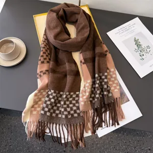Cozy cashmere-feel winter scarf with chic brown and pink plaid pattern and stylish fringe.