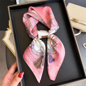Pink silk square scarf with luxury chain and tassel print, elegant neck accessory for women.