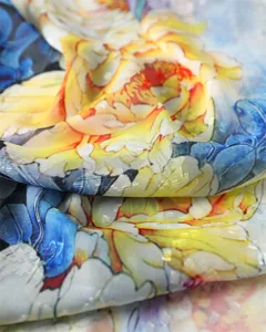 Close-up view showing the exquisite cut-out fabric texture and colorful floral print details.