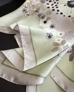 Elegant floral print silk square scarf detail view, premium green fashion shawl for women.