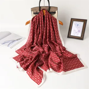 Red vintage print silk scarf detail, elegant retro chained pattern square shawl with white border.