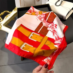Elegant red silk square scarf with vintage harness and bow print, luxurious women accessory.