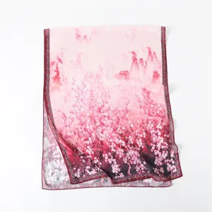 Detailed view of the pink floral silk scarf, featuring elegant landscape and blossom print.