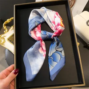 Close-up detail of the blue silk square scarf featuring vibrant peony flower print item.