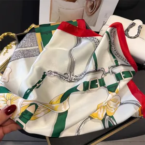 Elegant silk square scarf featuring classic equestrian print, red border, and versatile styling.
