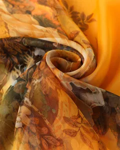 Detailed close-up of a lightweight yellow floral print scarf showcasing its soft texture.