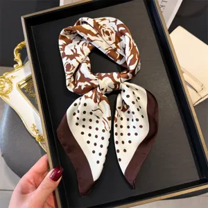 Brown and white floral polka dot silk square scarf detail, elegant vintage neckerchief design.
