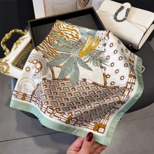 Detail view of a chic multi-style printed square silk scarf with elegant chic pattern.