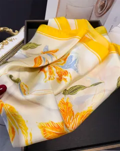 Elegant floral print silk square scarf, vibrant yellow and white design for women daily wear.