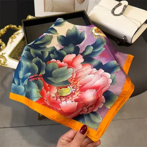 Luxurious floral square silk scarf with vibrant peony print and elegant orange contrast border.