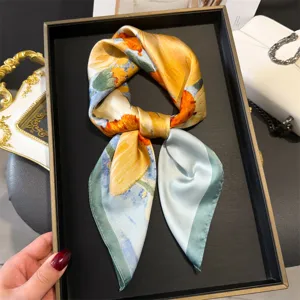 Closeup detail of the artistic floral print silk square scarf, elegant neck wrap and accessory.