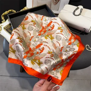 Chic tropical plant print silk square scarf, vibrant orange border fashion neckerchief for women.