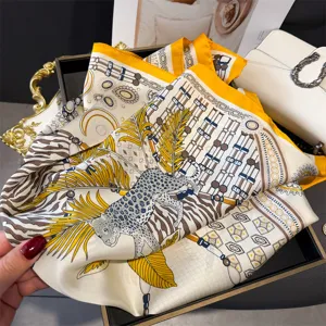 Luxury print square silk scarf with leopard and chain pattern, versatile elegant neck wrap.