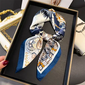 Detailed view of luxury printed silk square scarf with elegant geometric chain design.