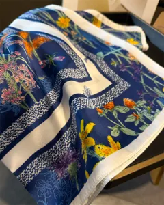 Silk square scarf with floral print, soft fabric detail, elegant neck scarf accessory.