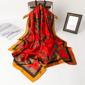Elegant red silk square scarf with floral fruit print and luxury style border design.