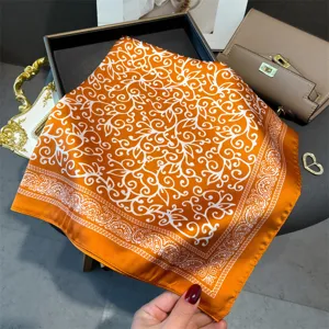 Orange silk square scarf with elegant white floral print, 70cm vintage neckerchief for women.