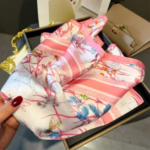 Chic 70cm square silk scarf with elegant pink floral and ribbon print for women's stylish daily wear.