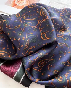 Detailed shot of a 70cm silk-feeling paisley square scarf, elegant floral neckerchief.