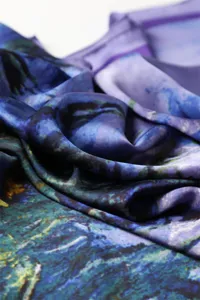 Elegant printed silk scarf detail view, artistic blue and purple oil painting pattern shawl.