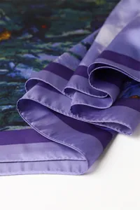 Elegant artistic print faux silk scarf with purple border, smooth texture for women.