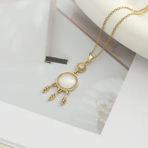 Elegant gold cat's eye dream catcher necklace with delicate leaf charms and sparkling zircon.