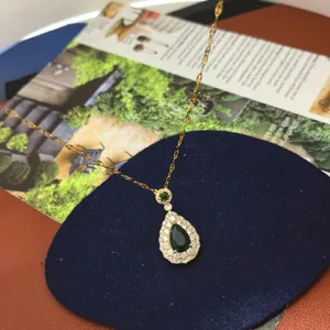 Exquisite teardrop green gemstone pendant necklace with dazzling micro-set cubic zirconia.