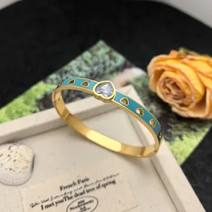 Titanium steel enamel heart bangle bracelet with sparkling cubic zirconia for women chic detail.