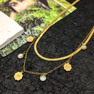 Detailed shot of double-layer titanium steel necklace with elegant floral and gem charms.