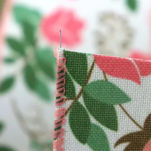 Close-up of pink floral wired ribbon detail showing edge stitching and wire. Perfect decor.