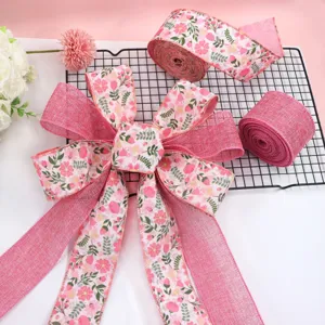 Pink floral wired ribbon faux linen fabric with large bow for gift wrapping and home decor.