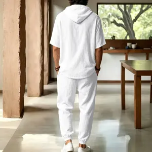 Men's casual white linen hooded short sleeve shirt and trousers set for beach vacation.