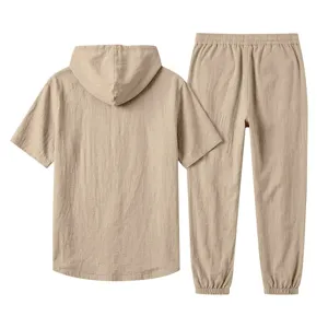 Detail view of men casual linen hooded short sleeve top and trousers matching set beige