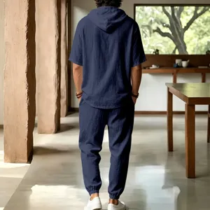 Men casual loose linen short sleeve hoodie and matching trousers set for summer beach holiday.
