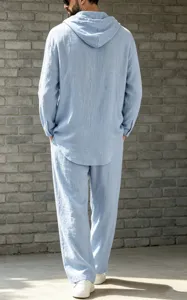 Back view of men's casual light blue linen hooded long sleeve shirt and matching pants set.