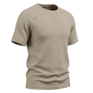 Close-up detail of mens waffle knit short sleeve t-shirt, raglan sleeve V-stitch neckline.