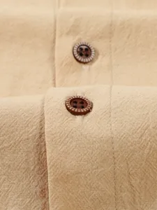 Men's casual breathable solid linen shirt fabric and stylish textured button detail.
