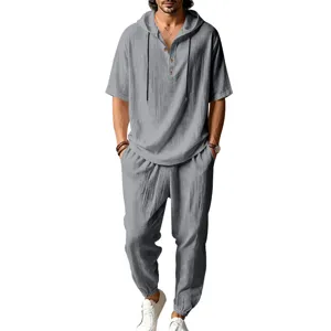 Men grey short sleeve hooded henley shirt and trousers set detail view for summer casual.