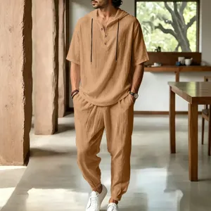 Detail view of men's casual loose linen hooded henley short sleeve shirt and long pants set.
