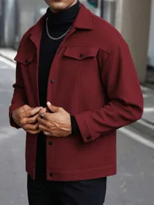 Detailed view of men's fleece wool blend jacket in dark red featuring snap buttons and collar.