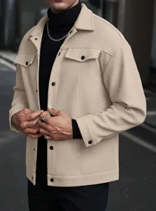 Detail view of men's casual beige woolen jacket featuring classic lapel and chic buttons.