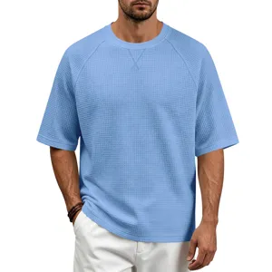 Men's light blue waffle knit short sleeve t-shirt with raglan design and v-stitch collar.