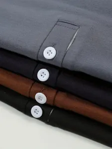 Men's long sleeve polo shirt detail view, classic lapel with button placket in assorted colors.